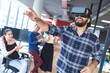 © WavebreakMediaMicro - Diverse group of creative colleagues talking at meeting using vr headset