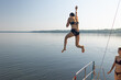 © zhukovvvlad - Girl jumping into the water from a yacht
