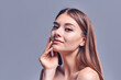 © Olena Apetroaiei - Beautiful young woman with clean perfect skin. Portrait of beauty model with natural nude makeup. Spa, skin care and wellness. Close up, gray background, copyspace.