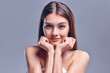© Olena Apetroaiei - Beautiful young woman with clean perfect skin. Portrait of beauty model with natural nude makeup. Spa, skin care and wellness. Close up, gray background, copyspace.