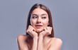 © Olena Apetroaiei - Beautiful young woman with clean perfect skin. Portrait of beauty model with natural nude makeup. Spa, skin care and wellness. Close up, gray background, copyspace.