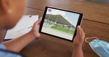 Poster - Composite of woman sitting at table with face mask, watching athletics high jump event on tablet