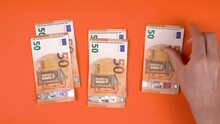 Person Is Dividing His Budged In Three Different Parts While Placing Euro Banknotes In Three Groups.  Perfect Shot For Financial Education, Planning Your Budged, Savings For Future, Invest Money.