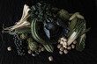 © Austockphoto - flemish style flat lay of fruit and vegetables with dark background