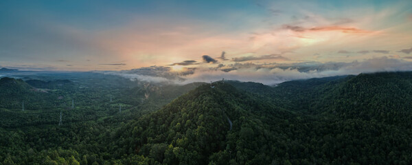 Wall Mural - Aerial view, Beautiful Panorama landscape sunrise over peak Mountain with warm light sunrise Mae Moh Lampang, Thailand