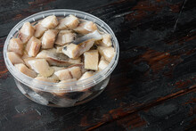 Fillet Of Salted Dutch Herring, On Old Dark  Wooden Table Background  With Copy Space For Text