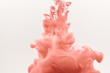 Satisfying Acrylic Pink Smoke Underwater Against A White Background