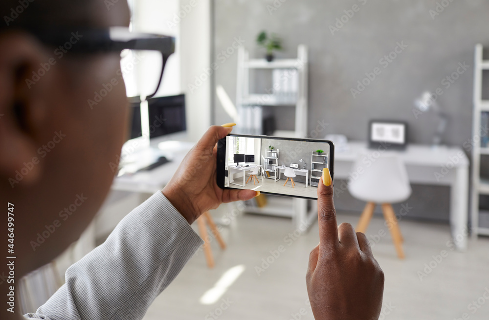 Black designer taking office interior photos, making presentation or video calling client using smart phone app. Rental agent or realtor shows work space while giving tour around display apartment - obrazy, fototapety, plakaty 