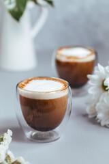 Wall Mural - Cups of coffee on a rustic wooden background