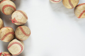 Poster - Baseball background with flat lay of old used balls isolated on white.