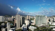 Aerial Footage Of Honolulu, Hawaii City Buildings With Rainbow