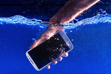 Smartphone splashing in water