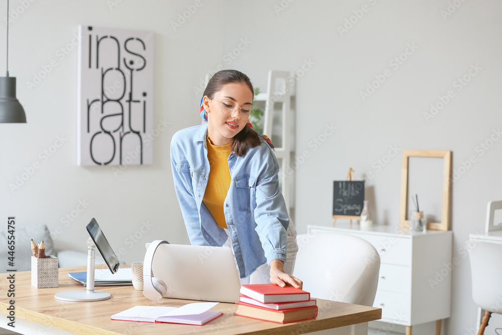 Female student preparing for exam at home