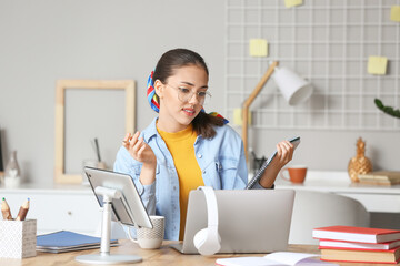 Canvas Print - Female student studying online at home