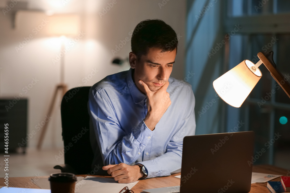 Businessman working in office late at night