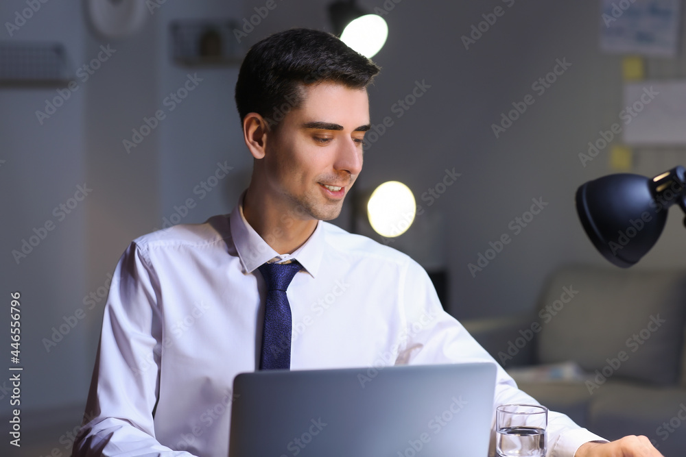 Businessman working in office late at night
