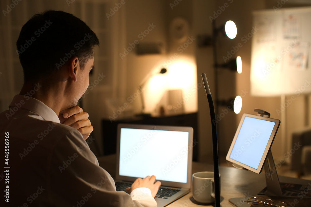 Businessman working in office late at night