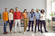 © Studio Romantic - Multiracial diverse young adult people standing together in bright office. Multinational colleagues team of different ages portrait. Happy smiling businesspeople or freelancer group professional staff
