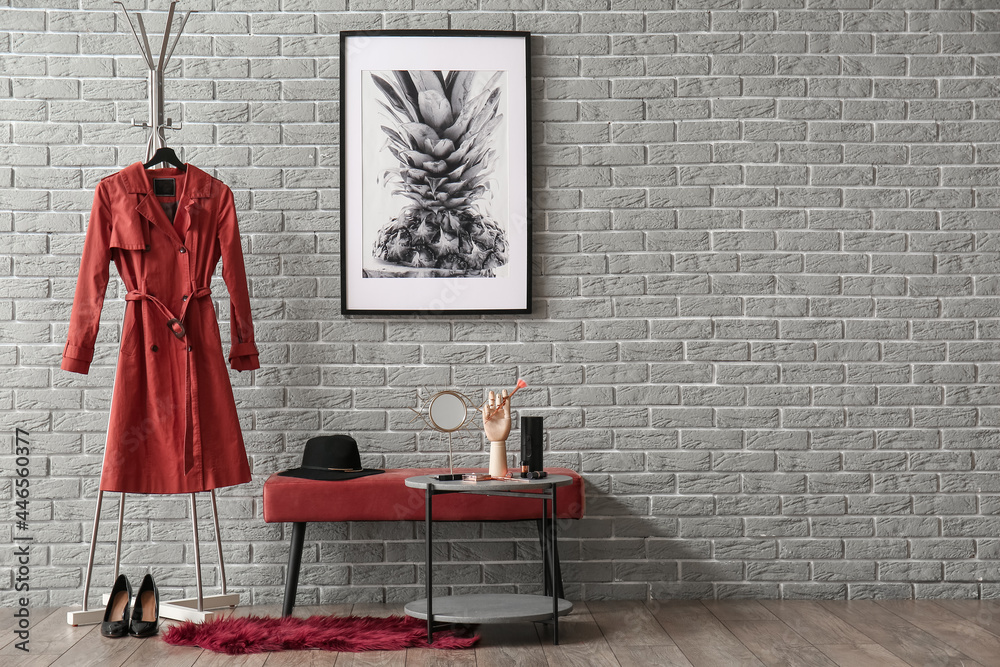 Interior of stylish hallway with ottoman