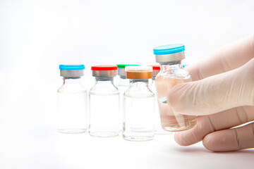 a bottle of vaccine on a white background