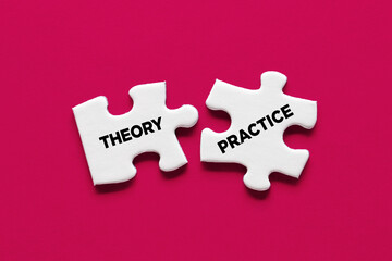 Theory and practice relationship or connection concept. Two puzzle pieces with the words theory and practice are connecting.
