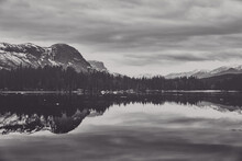 Faded Black And White Photo Of The Mountains, Lake And Snow And Reflection. 