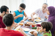 © Jasmin Merdan - Happy family enjoying eating food in dining room