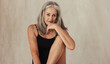 © Jacob Lund - Grey haired woman feeling confident in her natural body