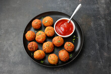 Fried Potato Cheese Balls Or Croquettes Cottage Cheese Paneer Ball Meat Balls With Tomato Sauce On Black Plate Over Dark Background. Fast Food, Top View.