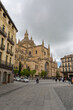 View at the Plaza Mayor and front view at the iconic spanish gothic building at the Segovia cathedral, towers and domes, downtown city