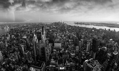 Fototapete - New York City skyline with Manhattan skyscrapers at dramatic stormy sunset, USA.
