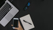 © Yukita Creative - Top View hand phone laptop on black background