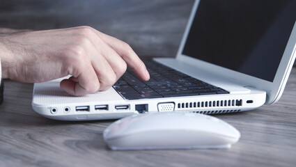 Wall Mural - Male hand typing on computer keyboard.