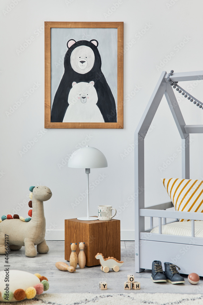 Stylish scandinavian child's room interior with mock up poster frame, creative bed, wooden cube, lamp, plush and wooden toys and hanging textile decorations. Grey walls, carpet on the floor. Template. - obrazy, fototapety, plakaty 