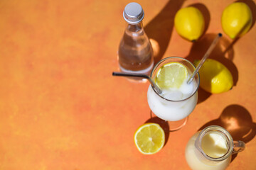  Creamy lemonade trendy summer mocktail. Cold non-alcoholic cocktail with lemon juice and sweetened condensed milk. Ingredients for prepare beverage.