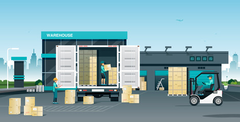 Wall Mural - Workers loading goods onto trucks in a warehouse.