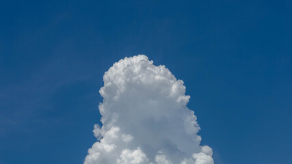 Wall Mural - Massive cumulus cloud builds vertically before the storm.