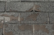 Broken worn asphalt roofing shingles fixit concept