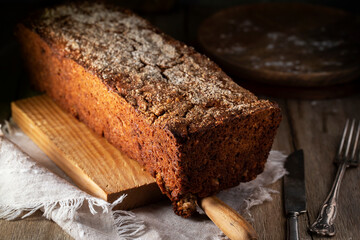 Gray rye bread on a wooden cutting board