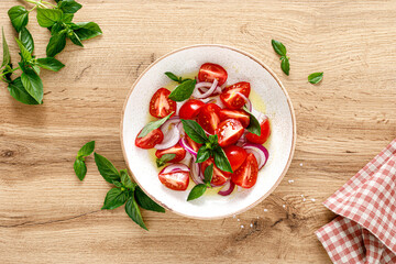 Canvas Print - Tomato salad with onion, fresh basil and olive oil, top view