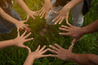 © RATTHAKORN - group of people hands together hands of many people together teamwork concept Working together for success