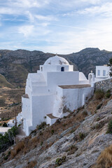 Wall Mural - Serifos island, Cyclades Greece. Church orthodox on rocky mountain background.