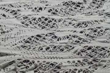 background macro texture of factory fabric with lace pattern
