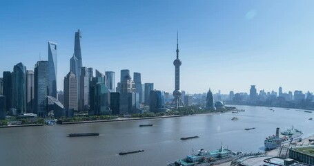 Fototapete - time lapse of Shanghai in afternoon, modern city skyline of Lujiazui Financial Center and busy Huangpu River, view of the North Bund, China.