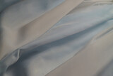 Fototapeta Koty - background macro texture of factory fabric with pleats