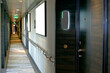 © Tamme Wichmann - Corridor or aisle to cabins, staterooms or suites on modern luxury Norwegian cruise ship or cruiseship liner interior