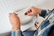 Hands Install Spare Parts In The Defective Toilet Cistern