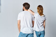 © SHOTPRIME STUDIO - man and woman in white t-shirts and jeans design casual clothing mockup