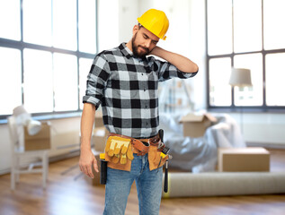 repair, construction and building concept - male worker or builder in helmet with neck pain over home room background