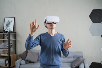 Wall Mural - man is using virtual reality headset. concept of virtual reality, gaming and future technology.